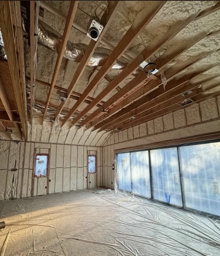 Interior walls and ceiling insulated with spray foam during new construction in Tustin
